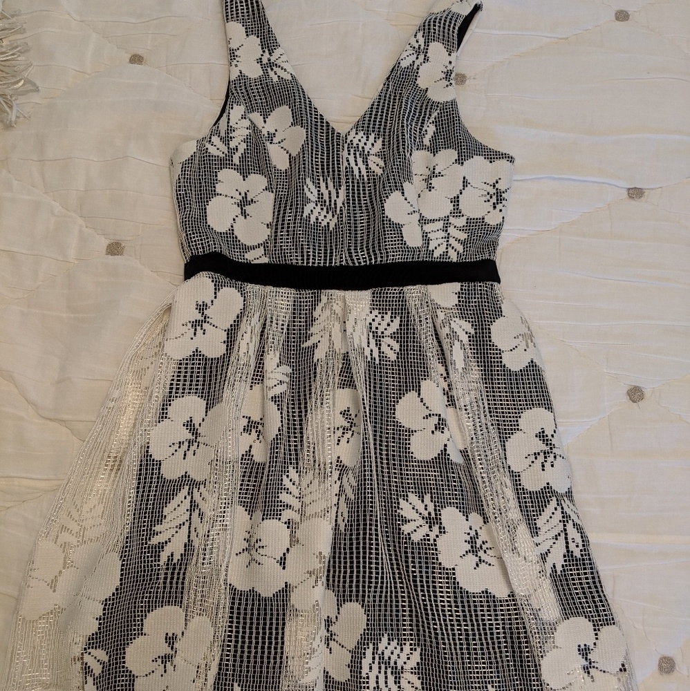 Black dress with white floral overlay
